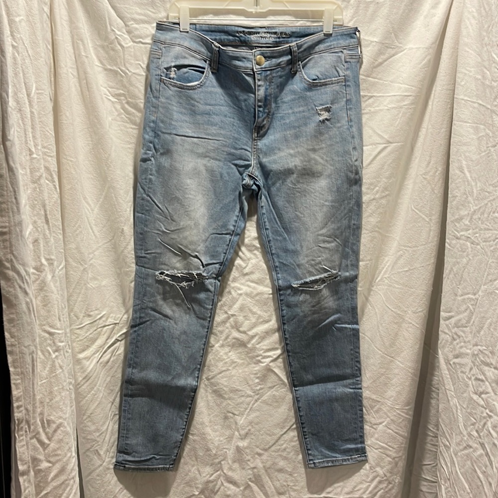 Size 14 stone wash super stretch jeans ripped at the knees